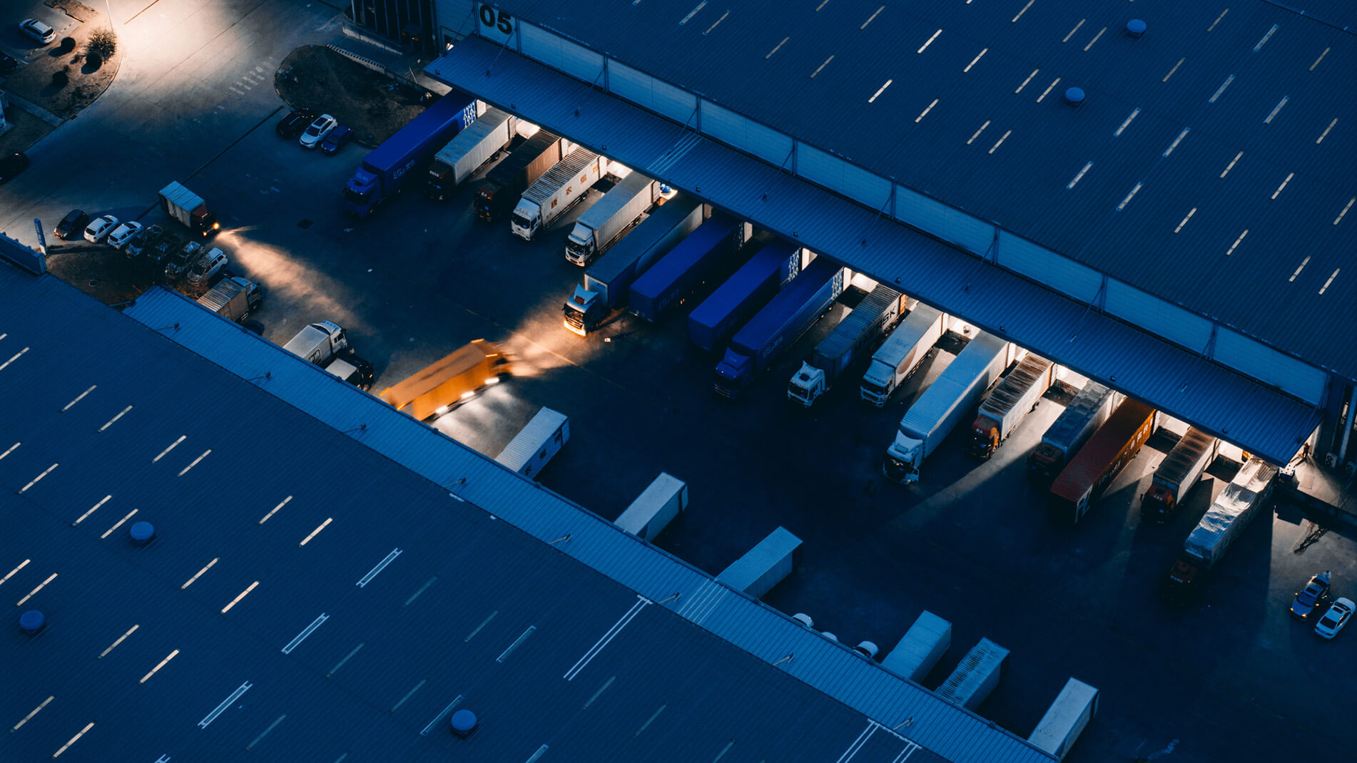 Multiple-ERP-Solution-2173942254-1902x1070.jpg Aerial image of a trucking yard.