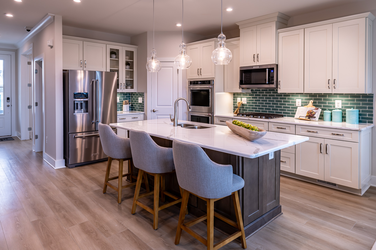 kitchen with a teal backsplash