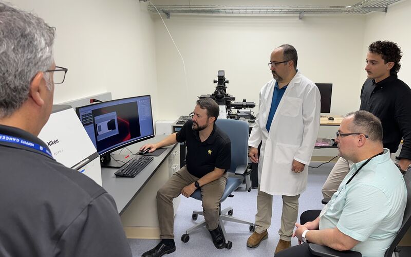 From left: Larry Kordon; Jacob Sawyer, PhD; Jose Serrano-Velez, PhD; Jorge Gomez, DVM; and Bismark Madera Soto explore the capabilities of the Eclipse Ji Smart Imaging System in a lab space at Moffitt Cancer Center’s Nikon Center of Excellence. 