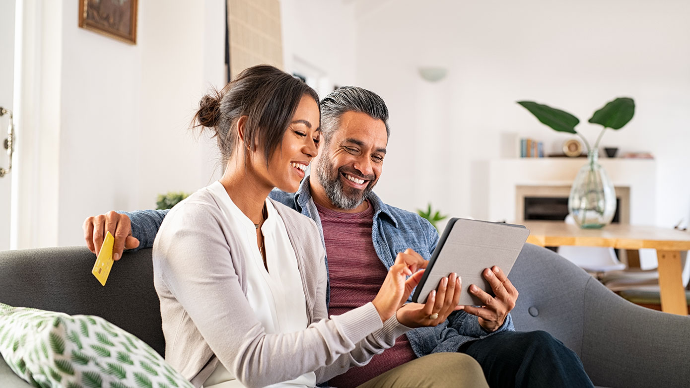 Consumers looking at an iPad for online shopping