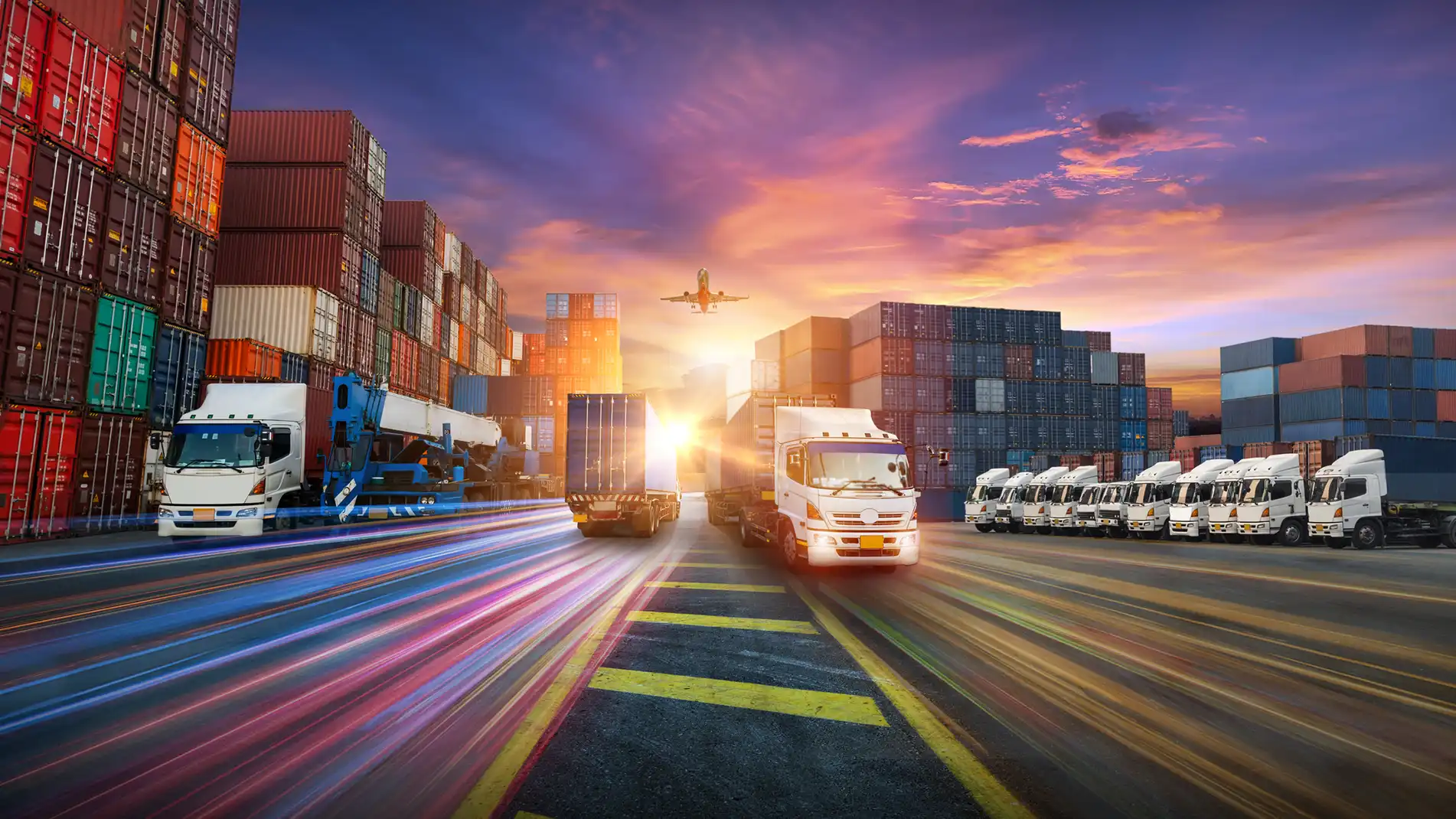 Optimized-Inventory-Performance-In-Page-5.webp Abstract image of trucks and shipping containers.