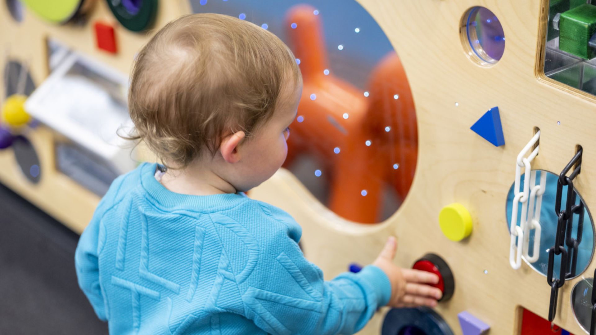 child playing playgroup toys