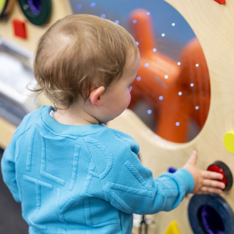 child playing playgroup toys