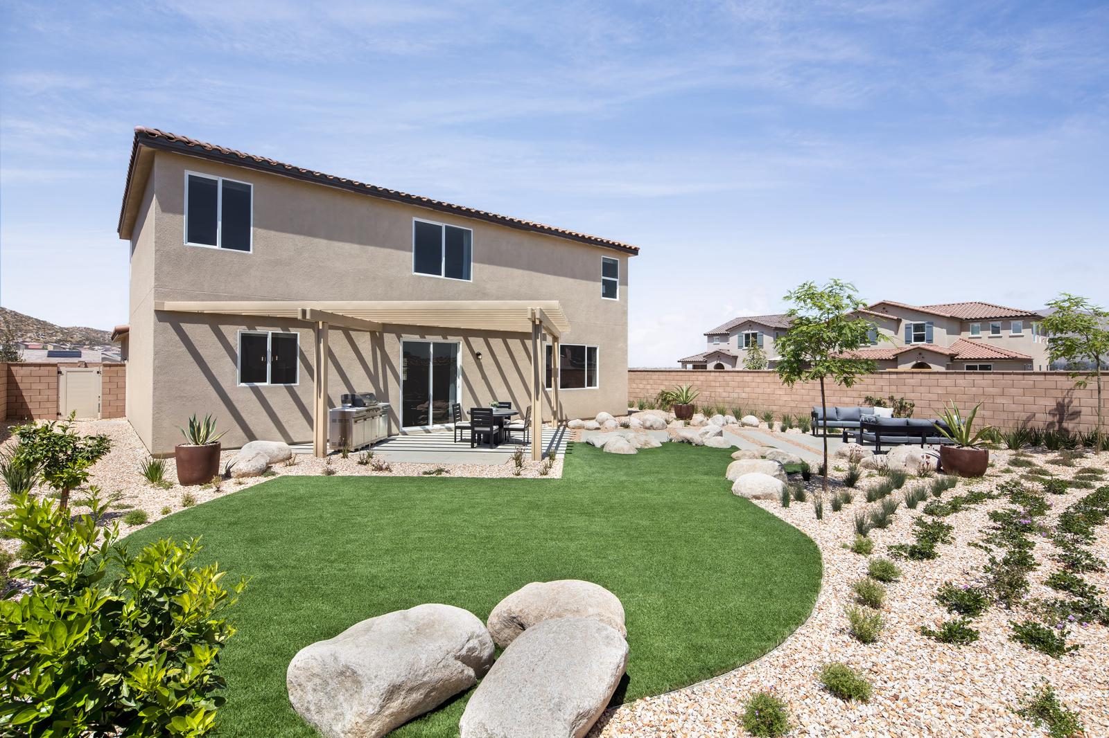 backyard with desert landscaping and seating area