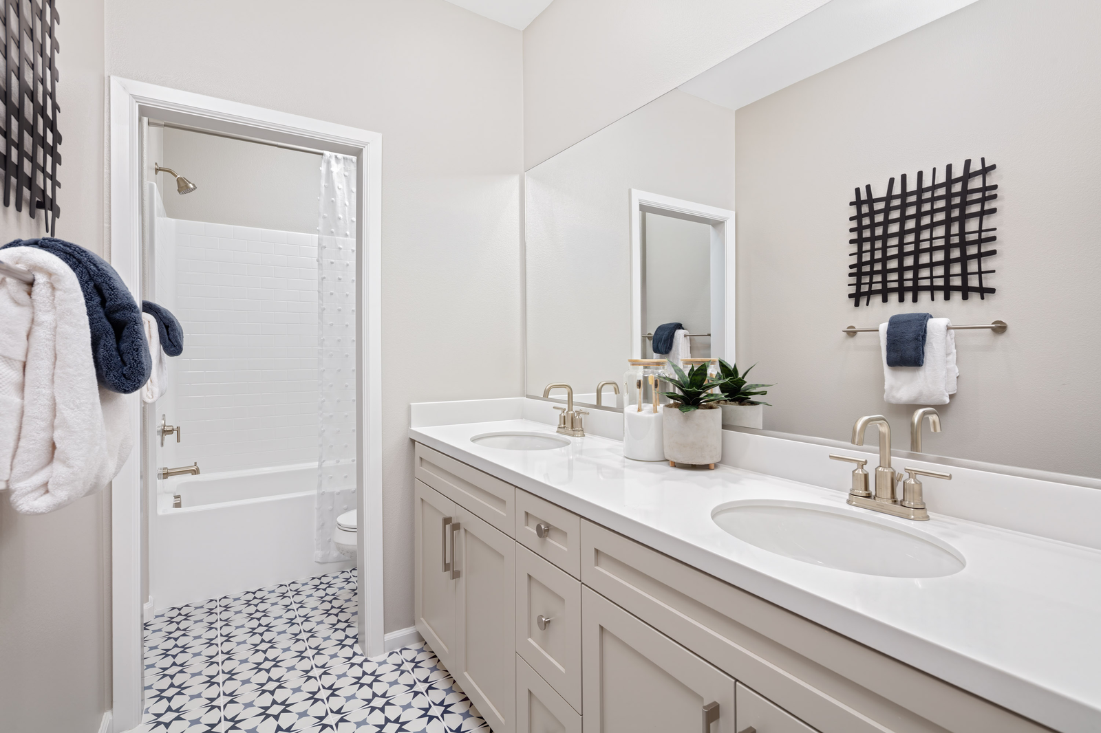 bathroom with tile flooring and white countertops