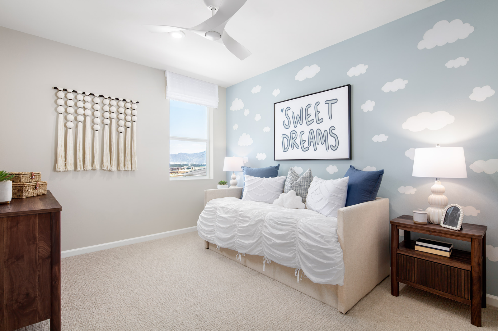 bedroom with neutral carpet and accent wall