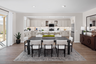 dining area with neutral floors near kitchen