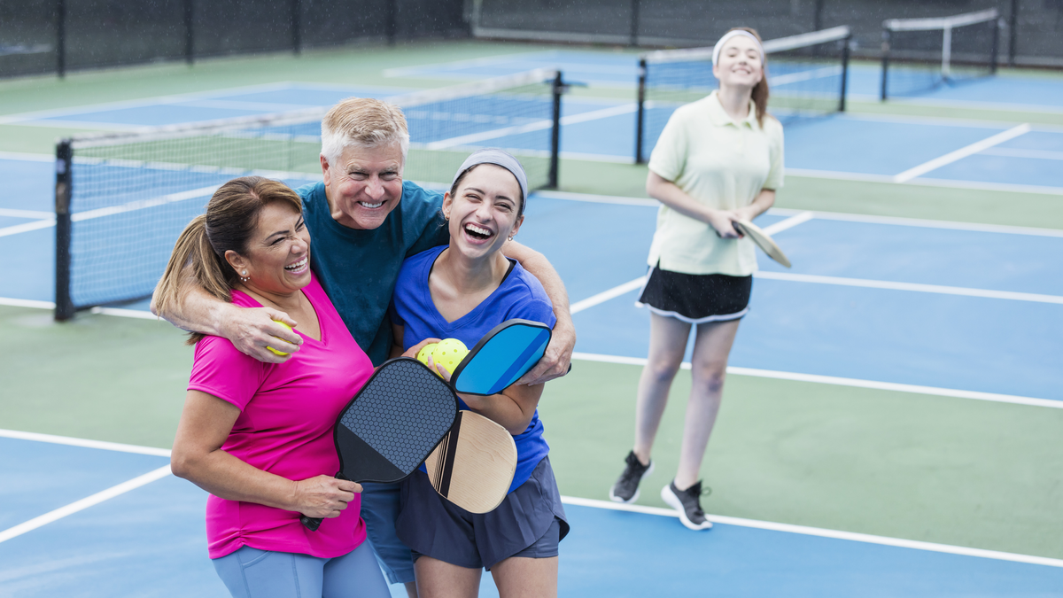 people enjoying a game of pickleball