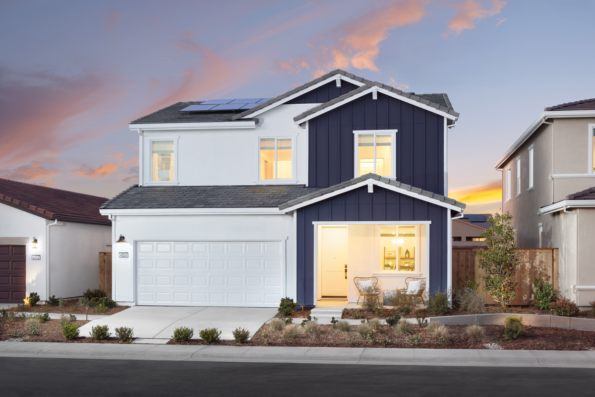 front exterior of two-story farmhouse style home