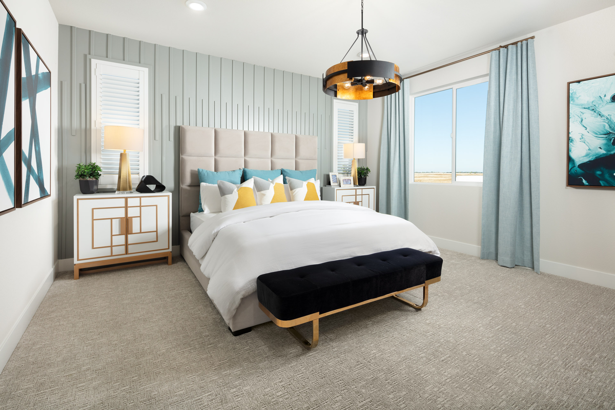 bedroom with upholstered bed and black bench