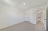 carpet throughout with a closet and a single window