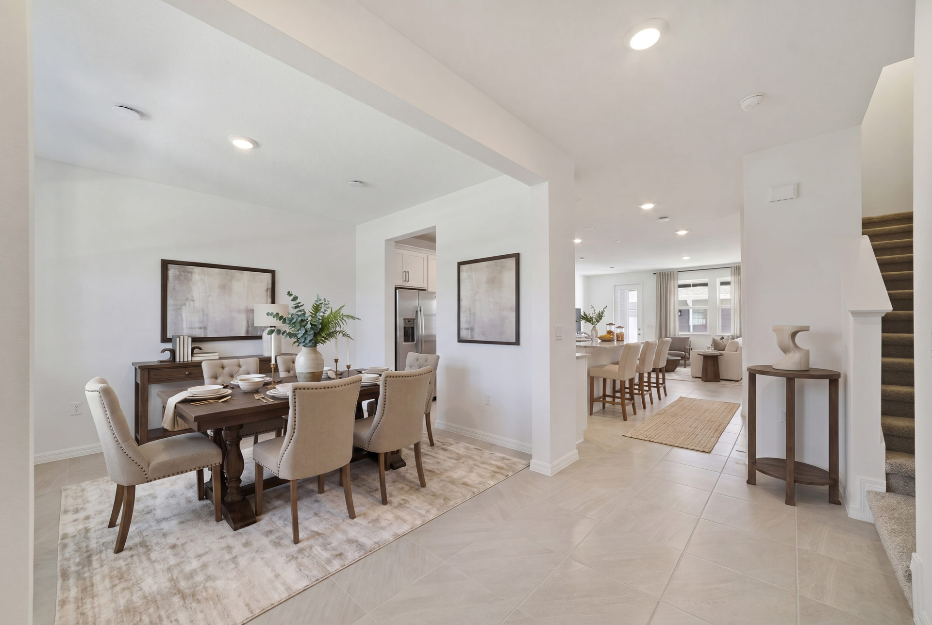 living room and foyer with access to stairs and the kitchen