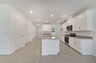granite center island and stainless-steel appliances  