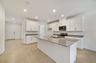 granite center island and stainless-steel appliances  