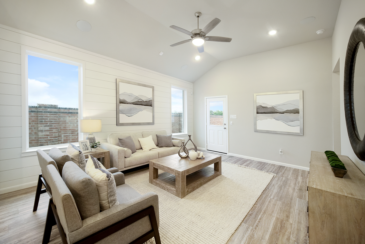great room with ceiling fan