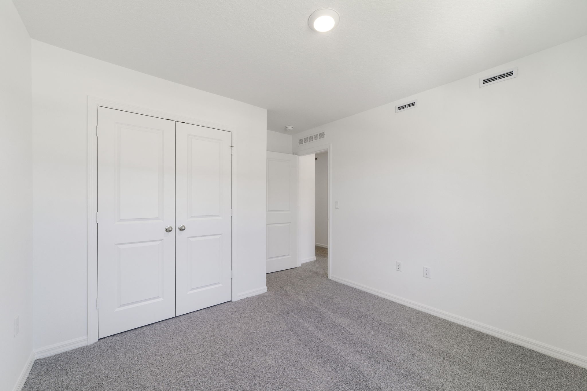 carpet throughout with a single window and closet