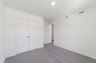 carpet throughout with a single window and closet