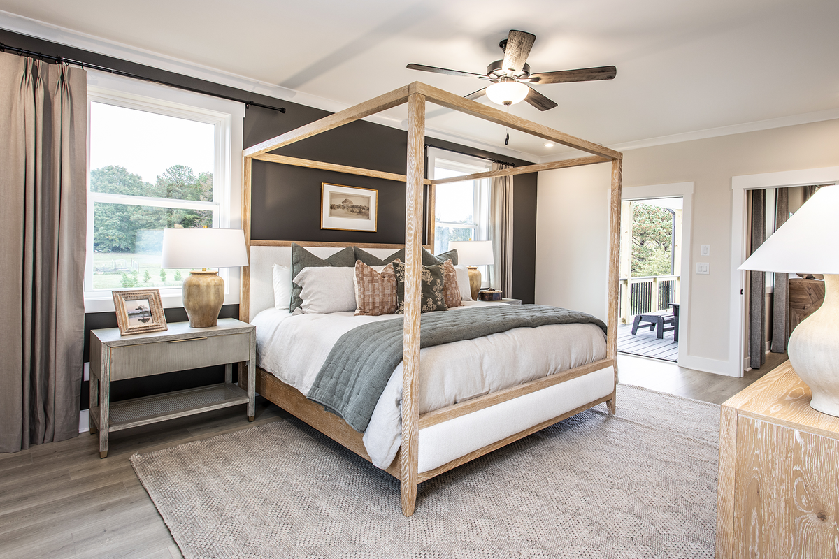 primary bedroom with king bed & light flooring