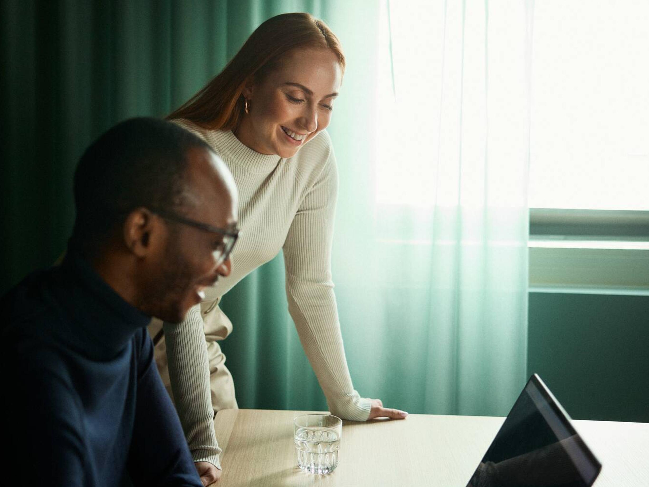 Man and woman working on a laptop
