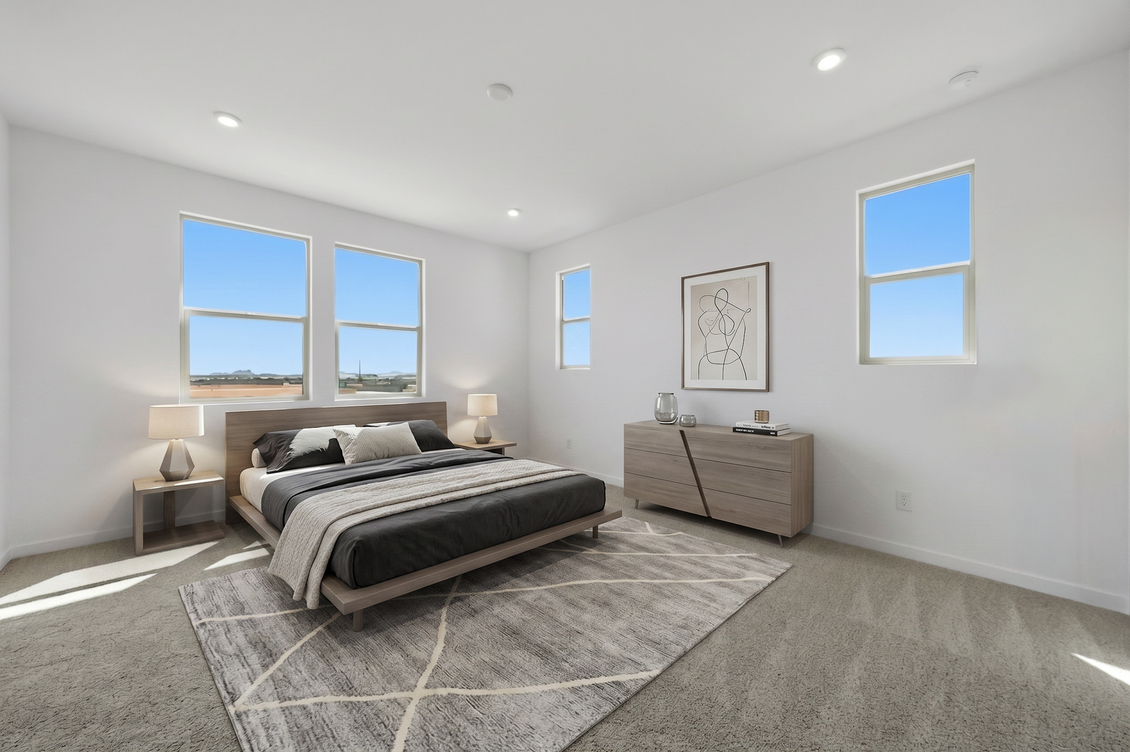 spacious bedroom with black bed covers, wooden bedframe, and oak nightstands