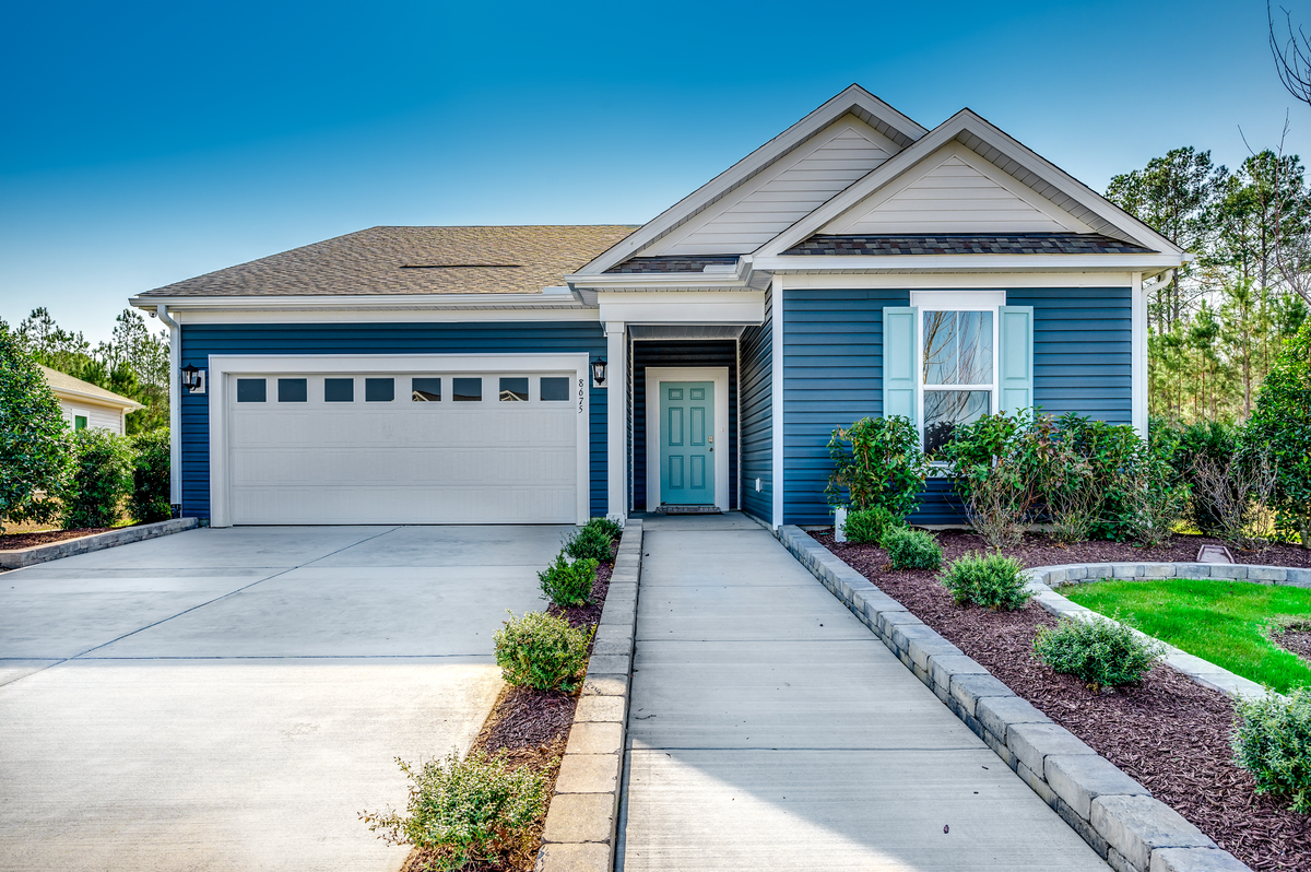 hardwood flooring and gray walls throughout