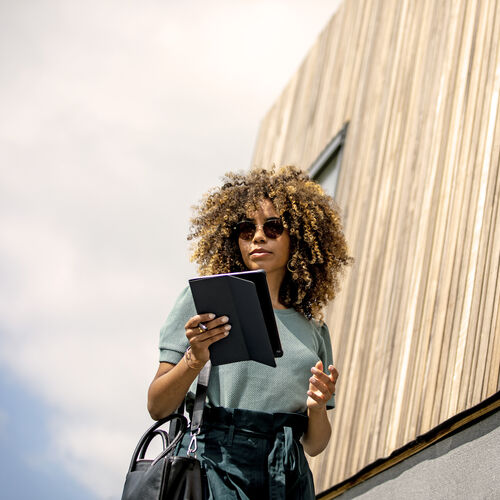 Woman wearing HOYA photochromic lenses outdoors