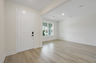 room with access to the front door and foyer 