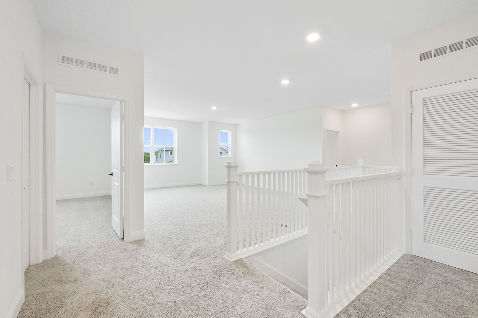 open space with access to stairs and upstairs bedrooms 