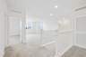 open space with access to stairs and upstairs bedrooms 