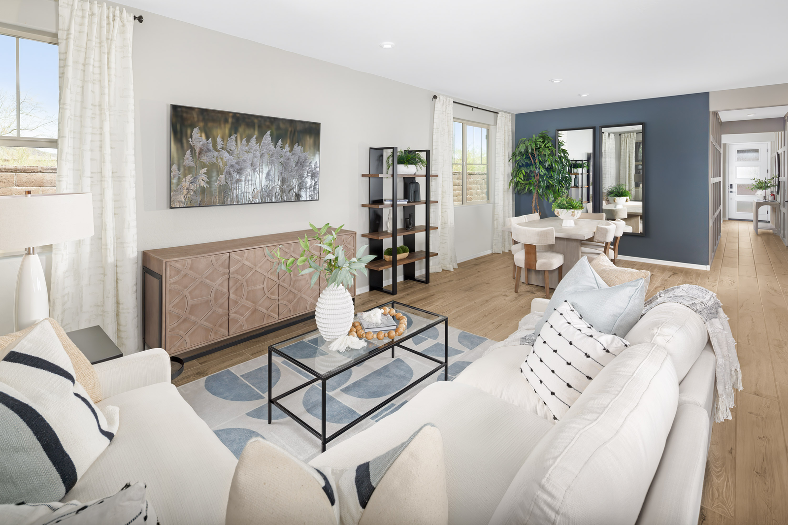 open-concept living area with sofa and chairs