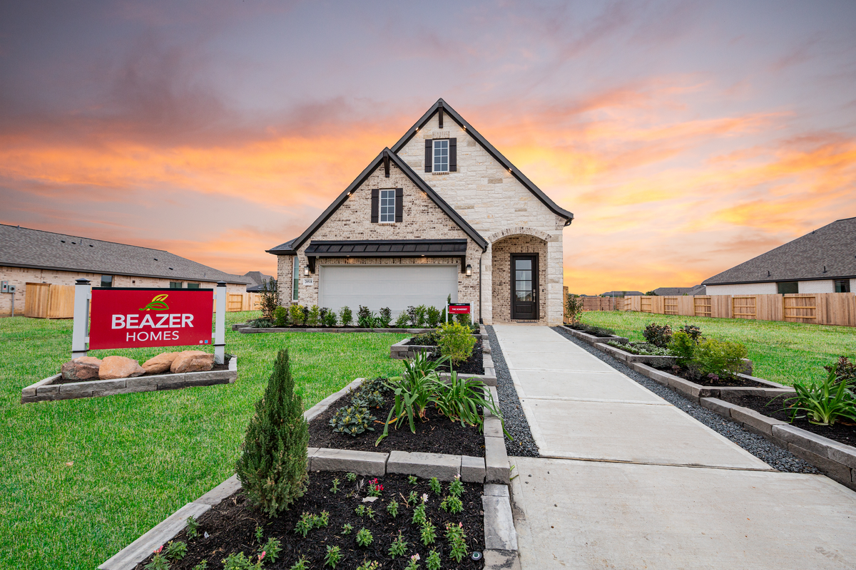 exterior brick home with garage door