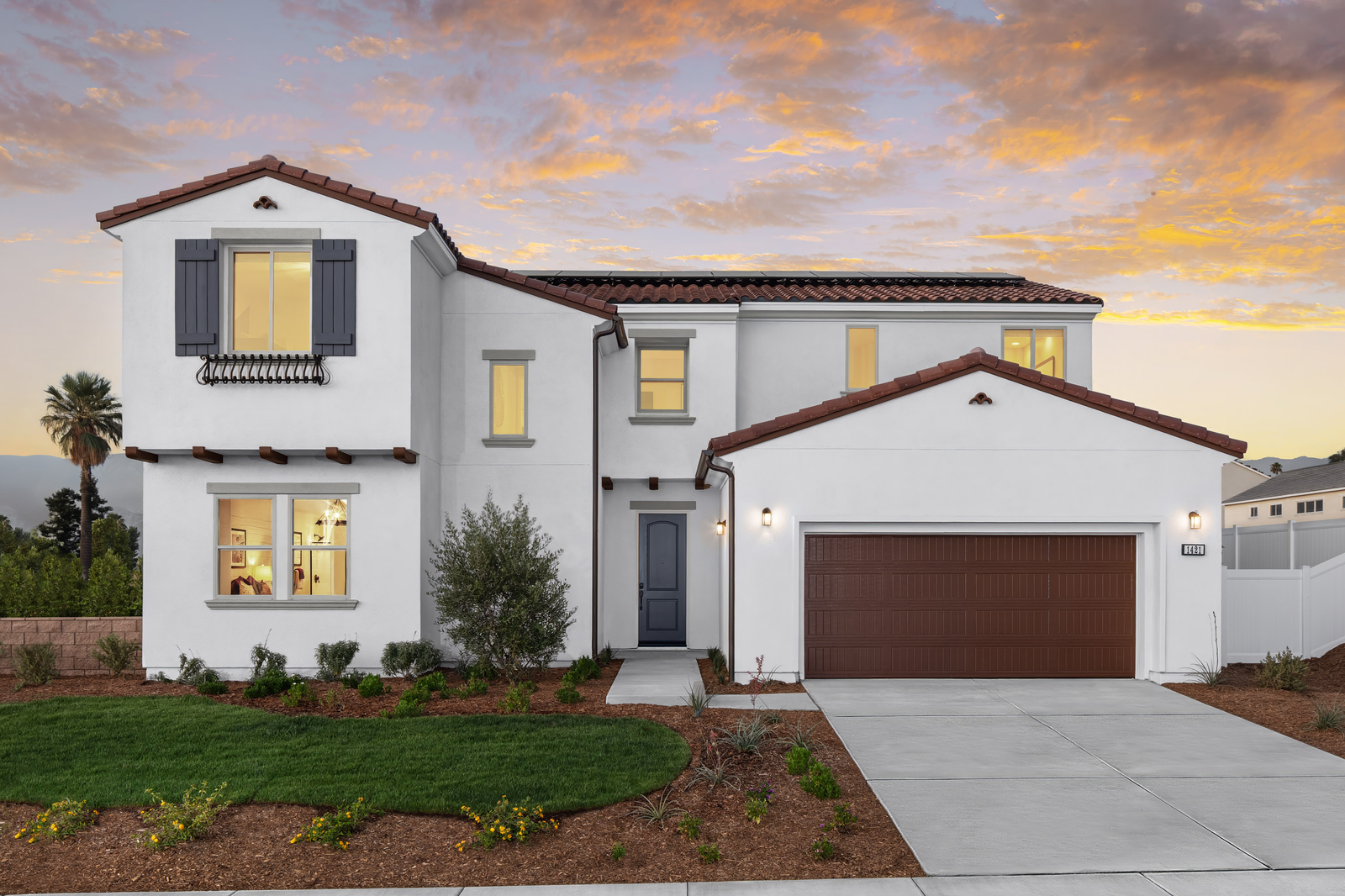 white two-story exterior with a dark brown windowless garage