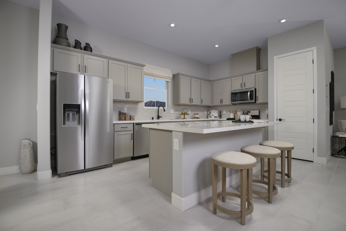 kitchen with stainless appliances & gray cabinets