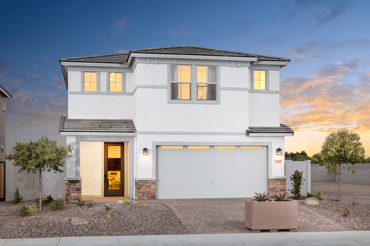 two-story home with concrete driveway