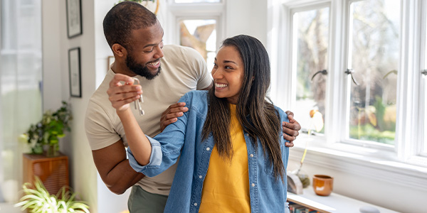 A happy couple who just bought a home