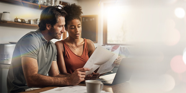 A couple looks at paperwork together 
