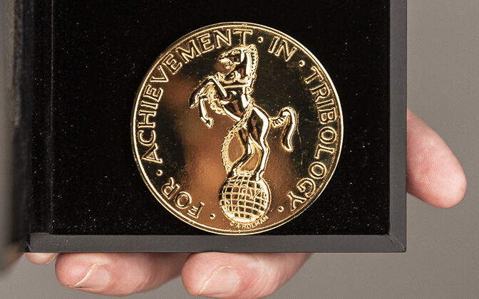 close up of tribology gold medal