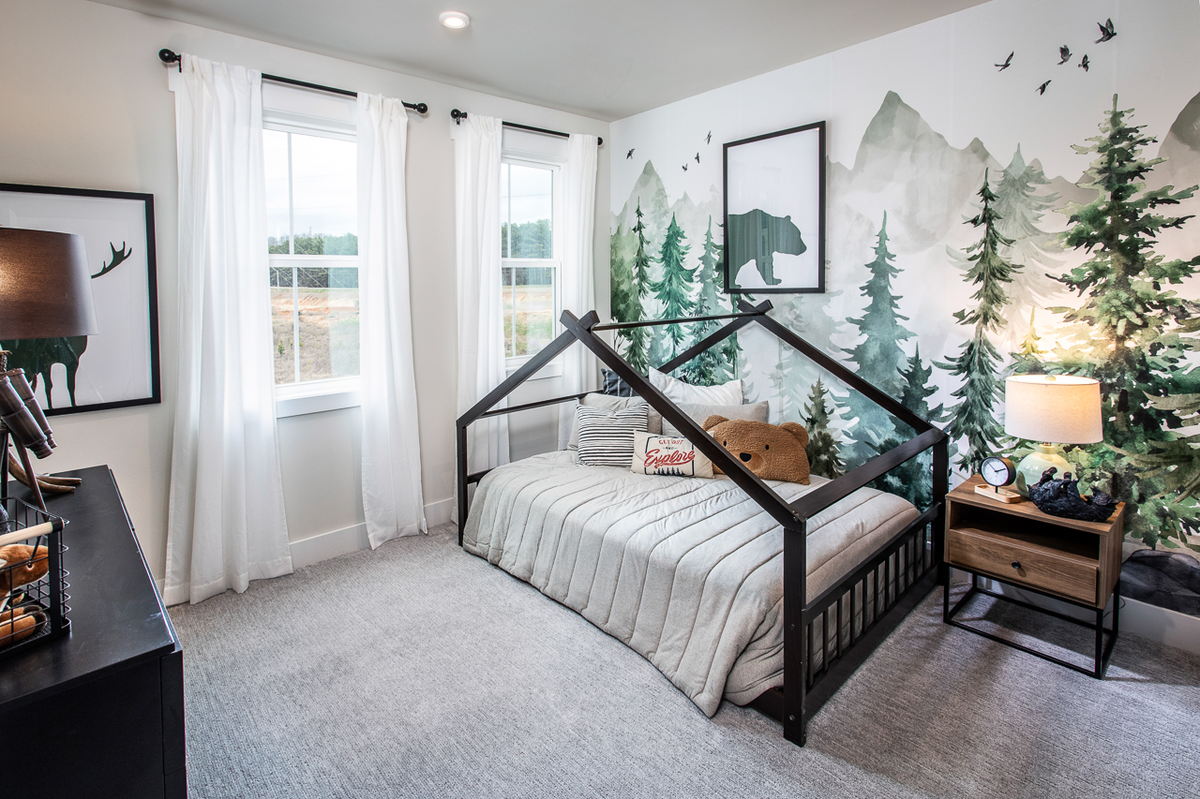 secondary bedroom with twin bed and neutral carpet