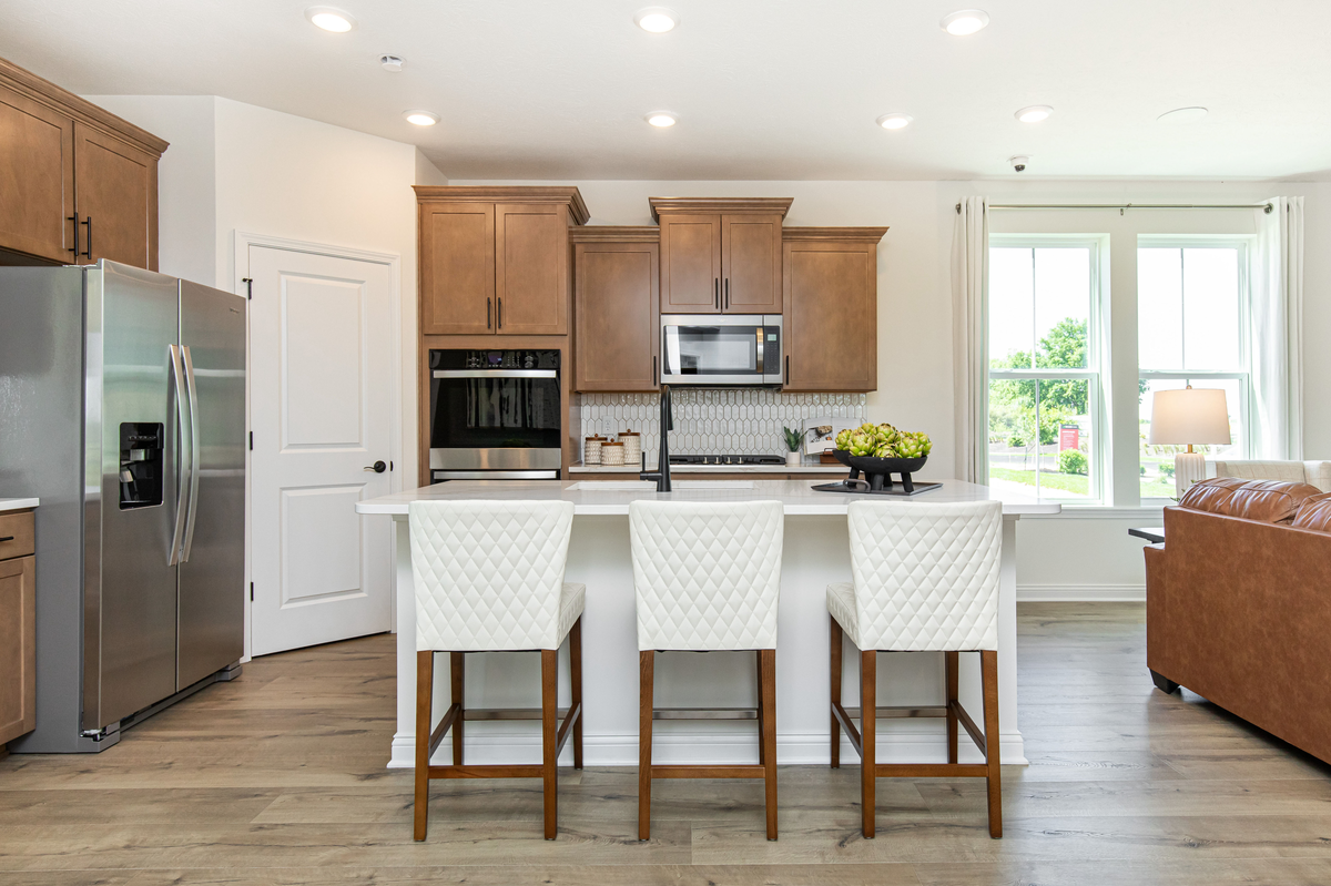kitchen with spacious island and bar stools