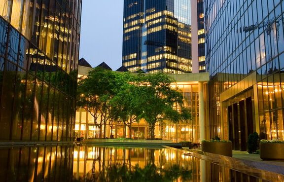 Empty plaza in between glass skyscrapers 