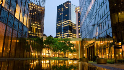 Empty plaza in between glass skyscrapers 