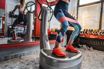 Person exercising on a vibration plate