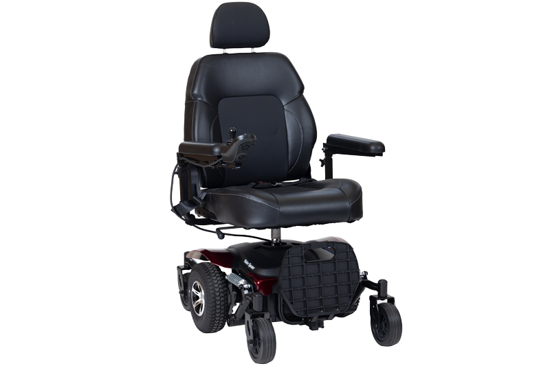 A powered wheelchair with a padded black seat, adjustable armrests, and a supportive headrest. It has mid-sized wheels at the back, smaller caster wheels at the front, and a joystick control on one armrest. The base features a red accent and a sturdy footplate.