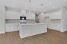 kitchen with white cabinets and quartz counters
