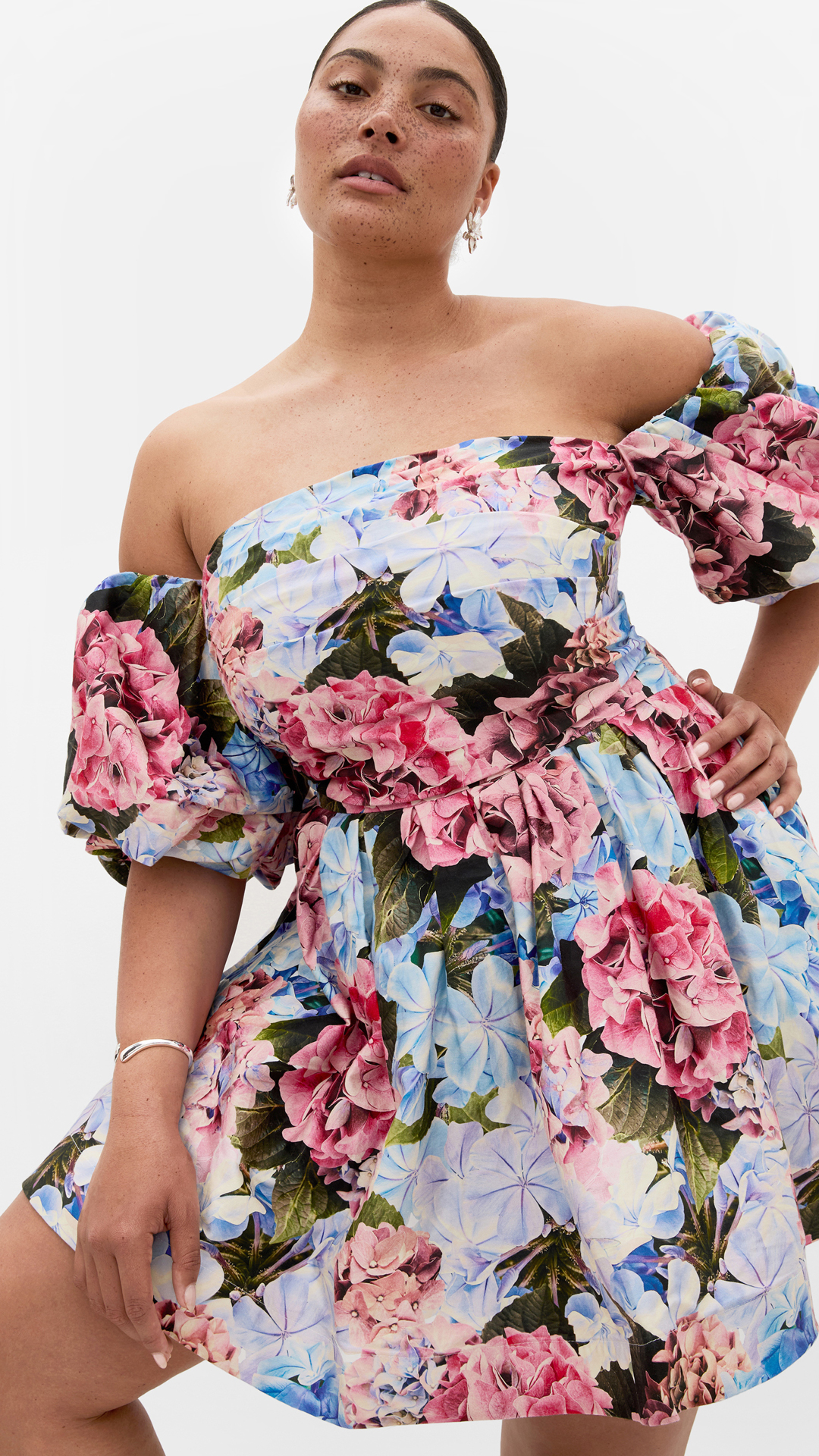 woman in a plus-size floral summer dress