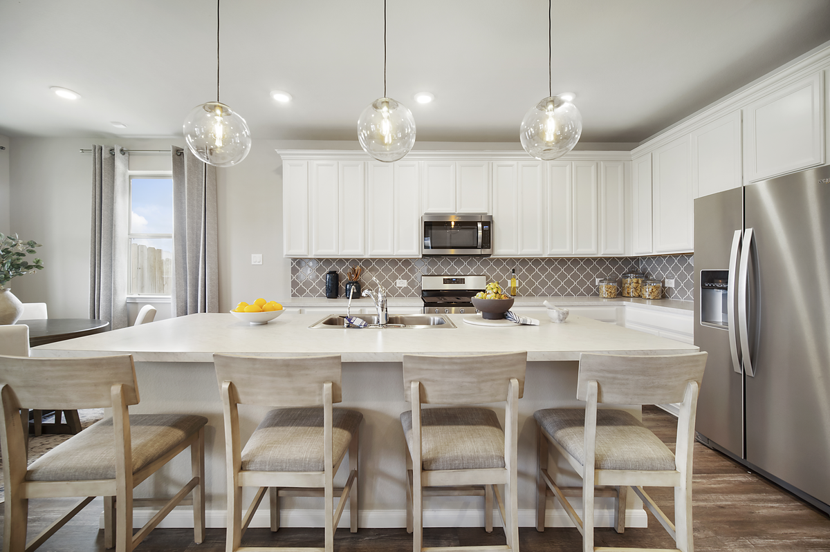 kitchen with large island and bar stools