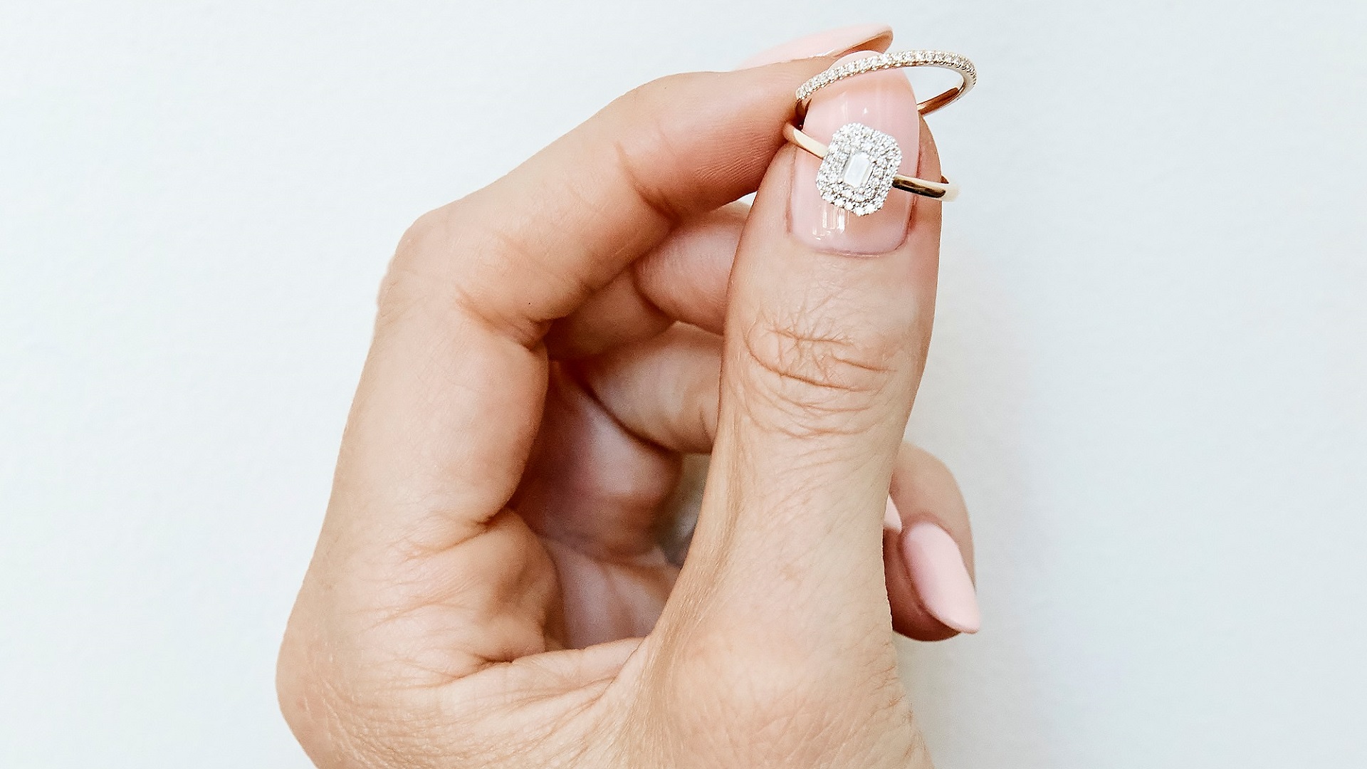 Hand holding two rings