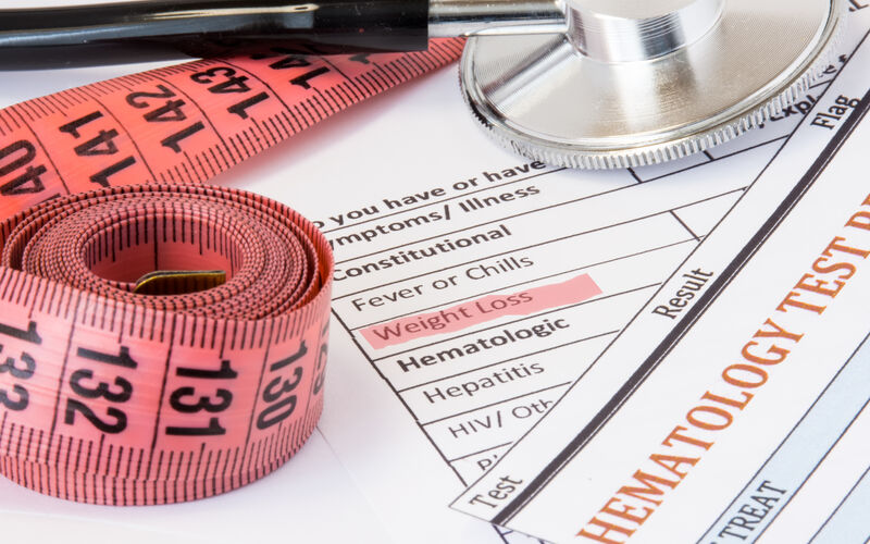 image of measuring tape, stethoscope and some test results