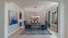 dining room with wood flooring, large light fixture and large windows