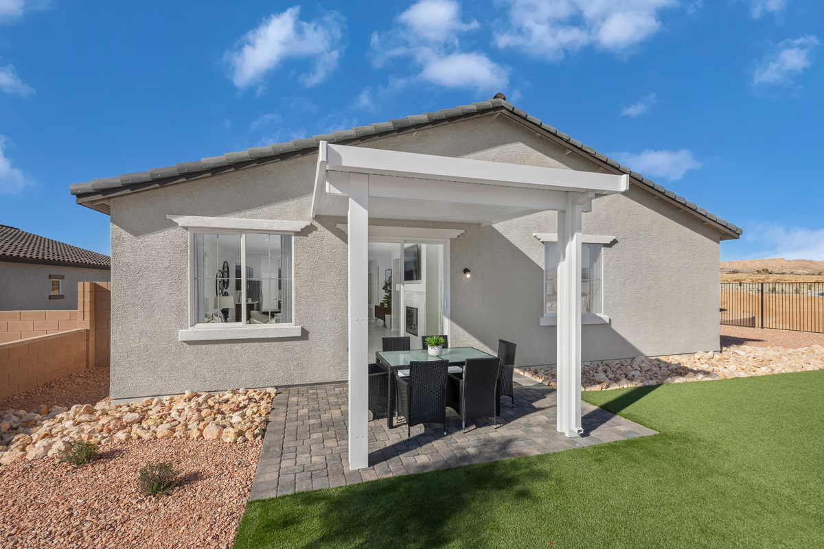 backyard with covered patio and brick pavers